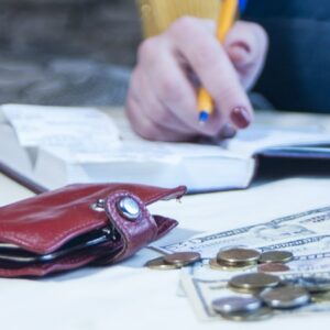 a business woman calculates the financial costs and revenues,