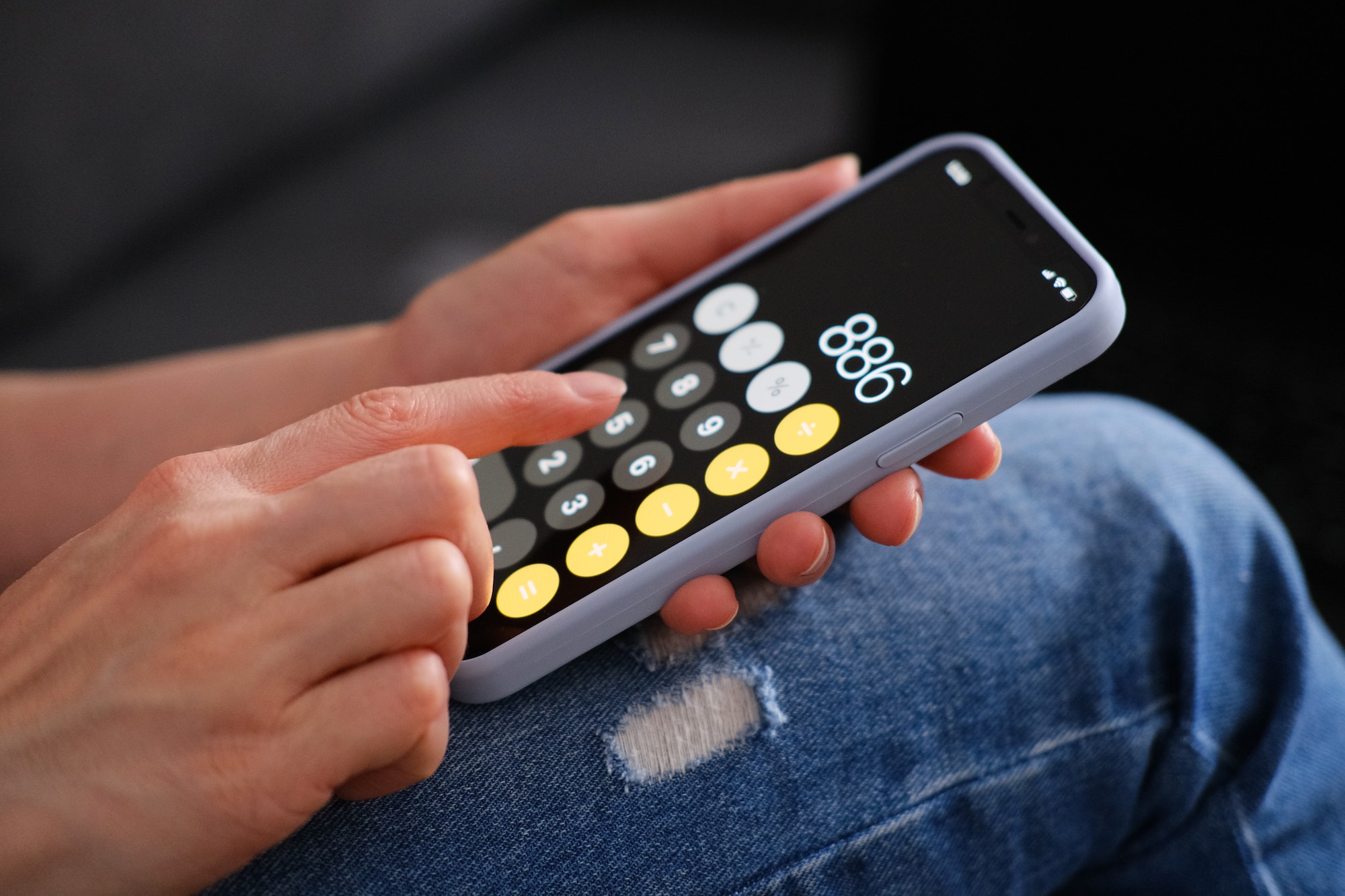 Close-up enjoying a calculator on the phone